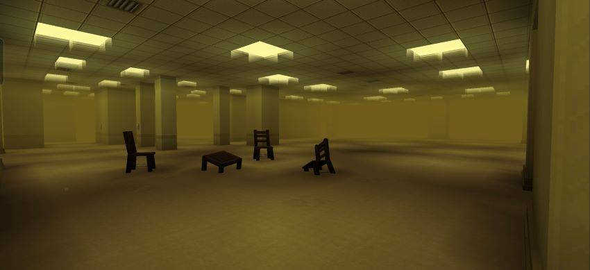 Room with office furniture and yellow walls